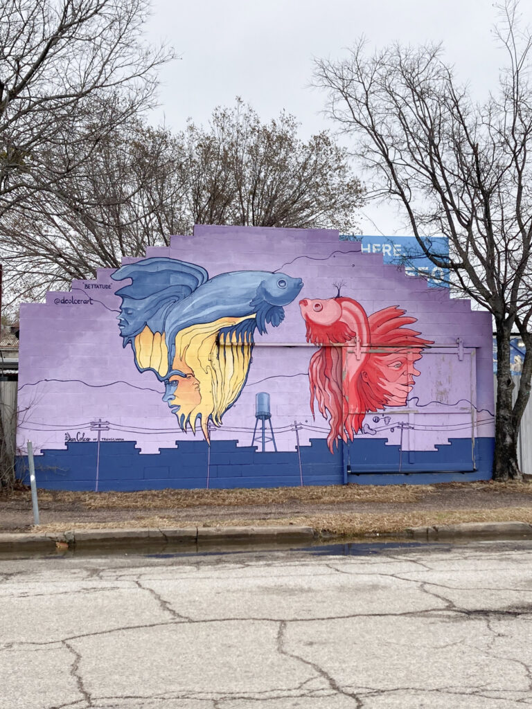 Colourful kissing fish mural in Deep Ellum