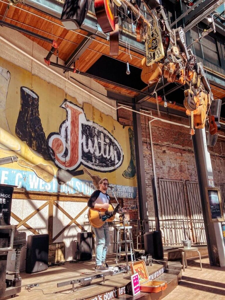 A live musician at a Honky Tonk restaurants at Fort Worth Stockyards