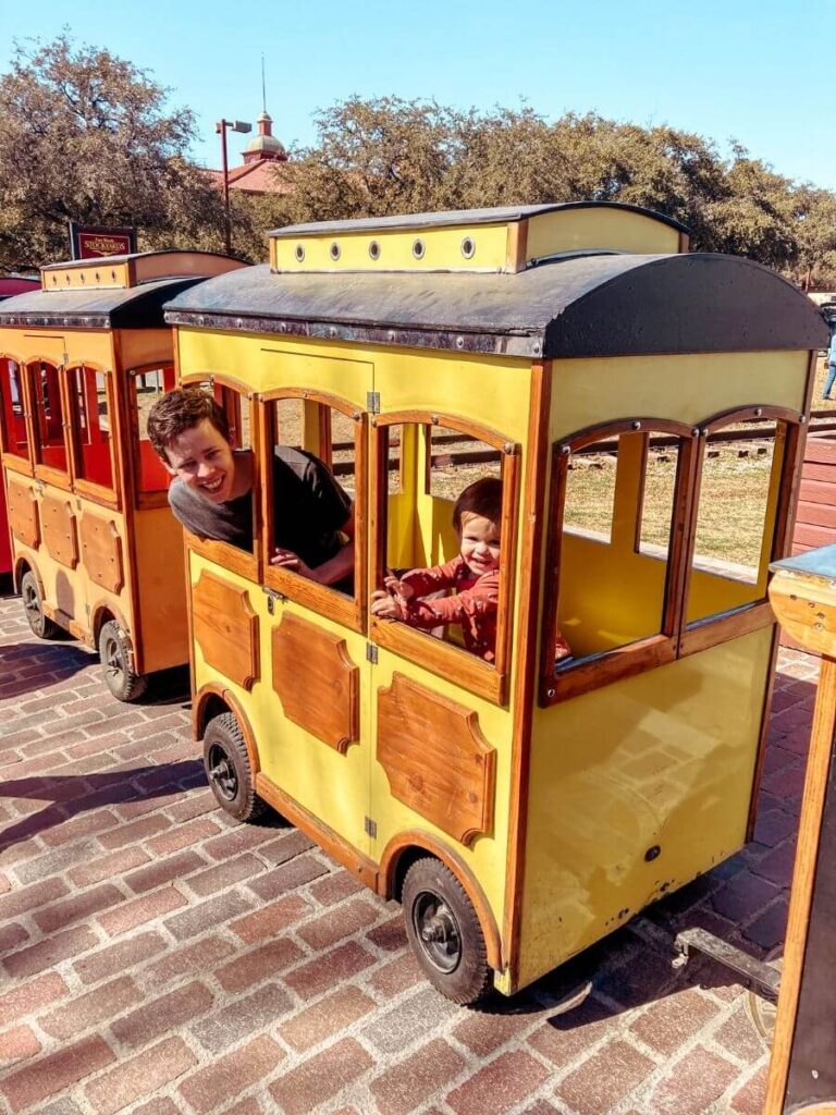 Father and son enjoying the Stockyards train rides for kids