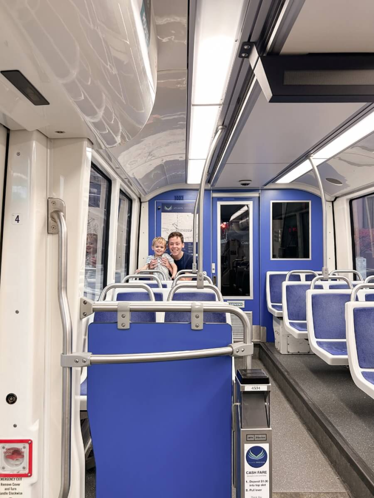 Father a son riding the streetcar. A fun and cheap thing to do in Atlanta with kids. 