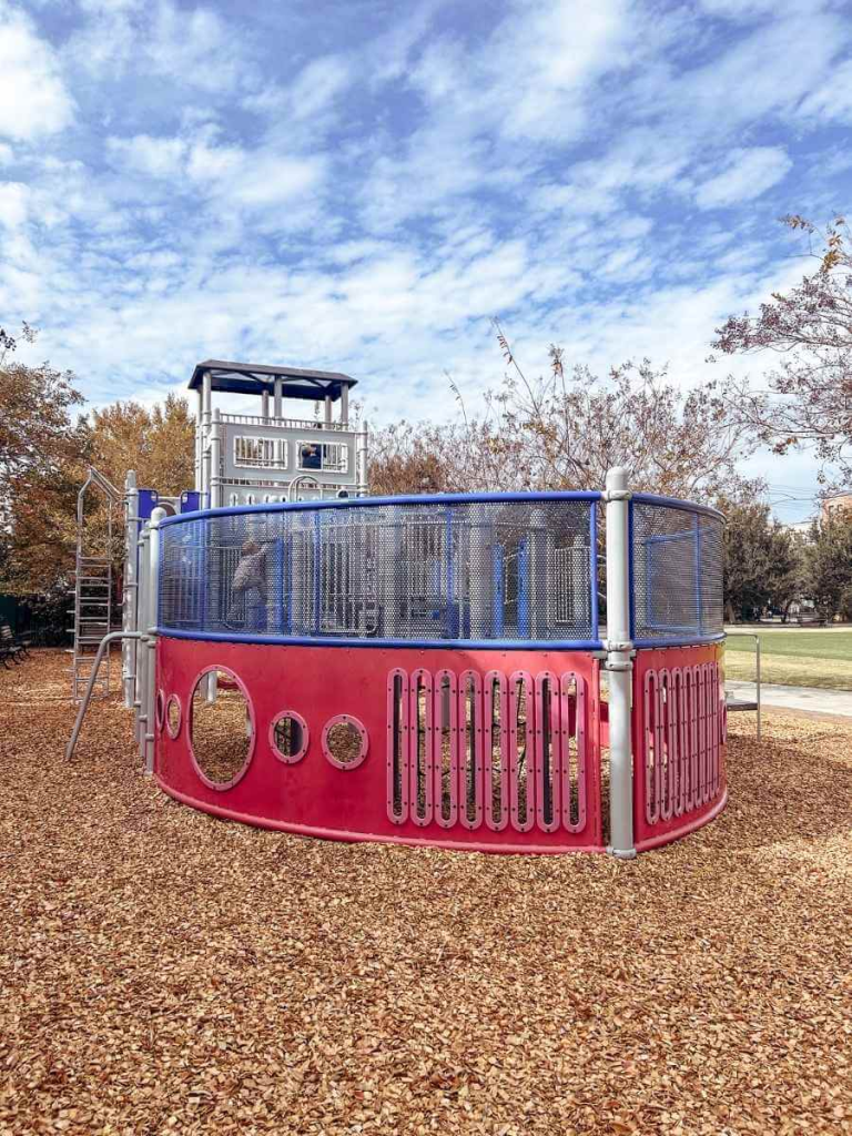 Children having fun and burning some energy in the Gadsdenboro Park Playground, that has a boat shaped jungle gym.