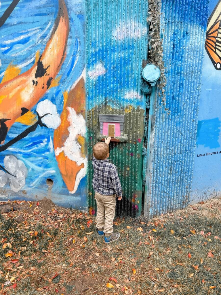 Colorful Tiny Doors ATL art installation on a wall in Atlanta, a fun and free thing to do in Atlanta with kids.