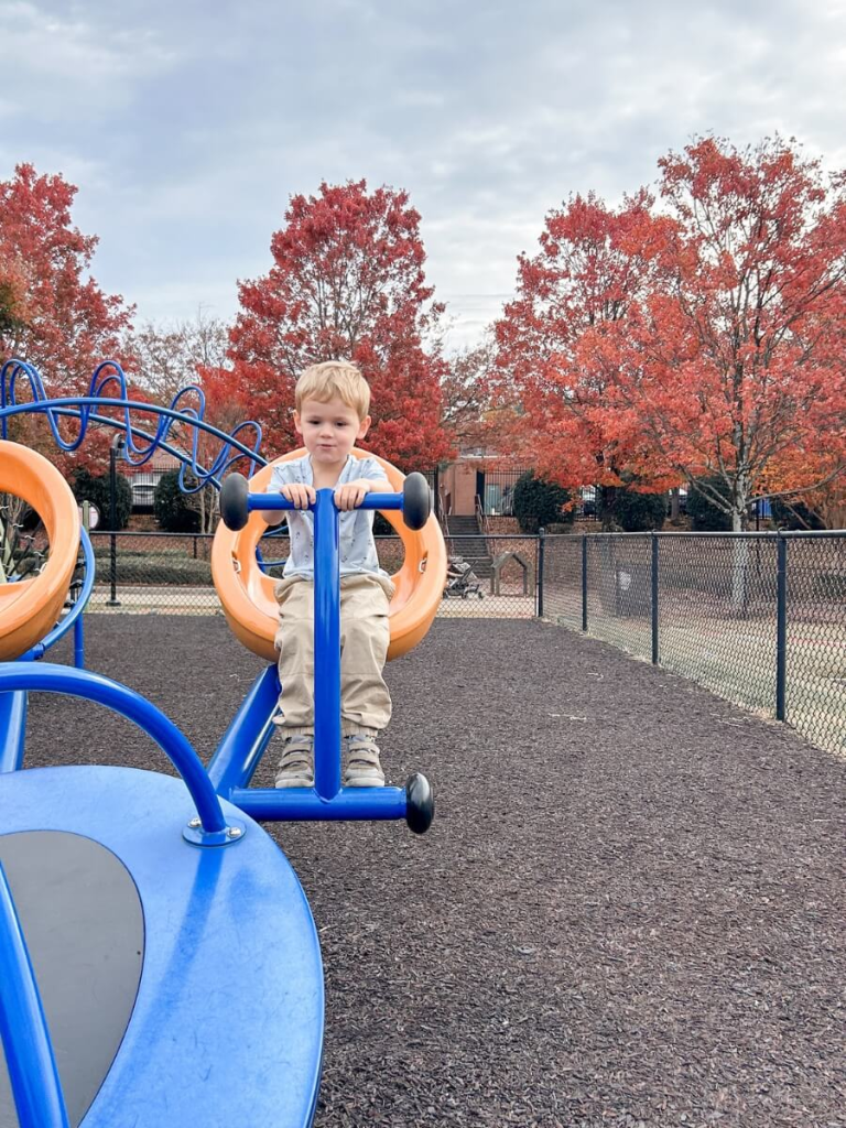 → Child playing in the playground at Martin Luther King Jr. National Historical Park, perfect for when you're looking for free and cheap things to do in Atlanta with kids.