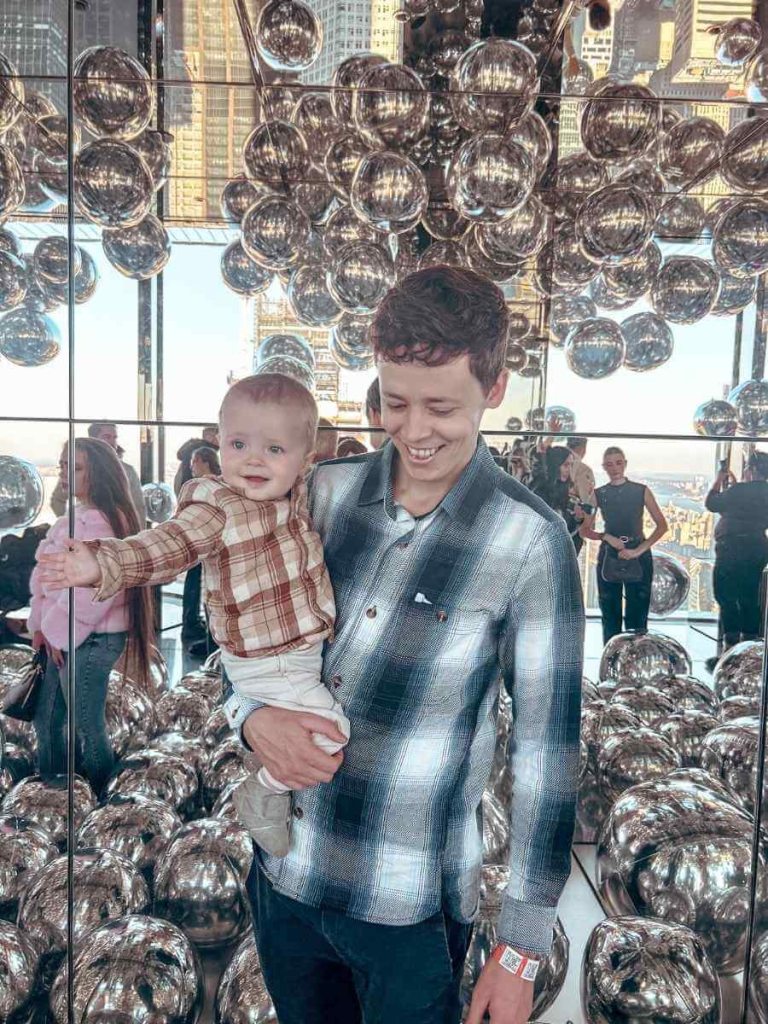 Family inside the mirror-filled Ball Room at Summit One Vanderbilt — immersive observation deck experience in NYC