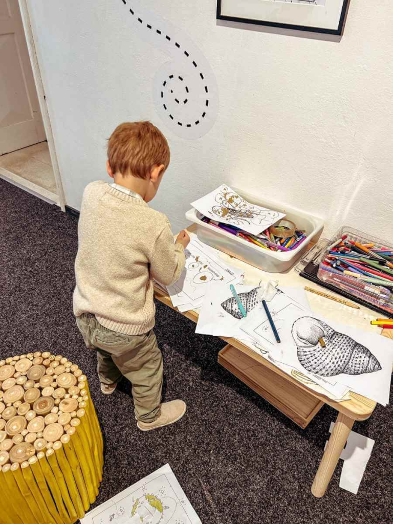 Young child colouring in the Cultural History Museum in Dubrovnik — a family-friendly indoor activity