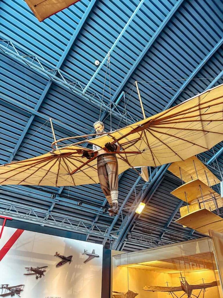 Exhibits from the Flight Gallery at the Science Museum London, featuring historic glider suspended from the ceiling
