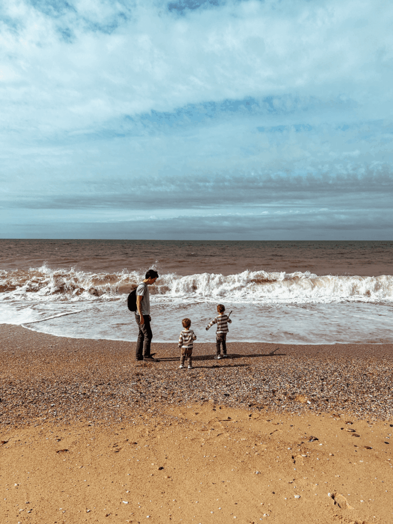 Playing on a family-friendly beach in Faro, Portugal with kids