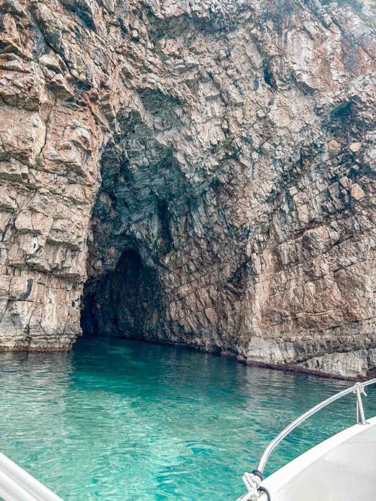 Stunning turquoise waters inside the Blue Cave, a popular boat tour stop near Kotor.