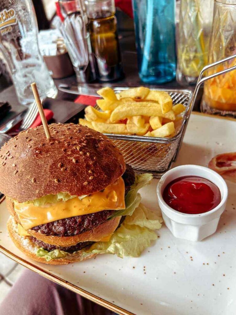 Close-up of a gourmet burger served at Caffe Bar Galerija in Niksic Montenegro