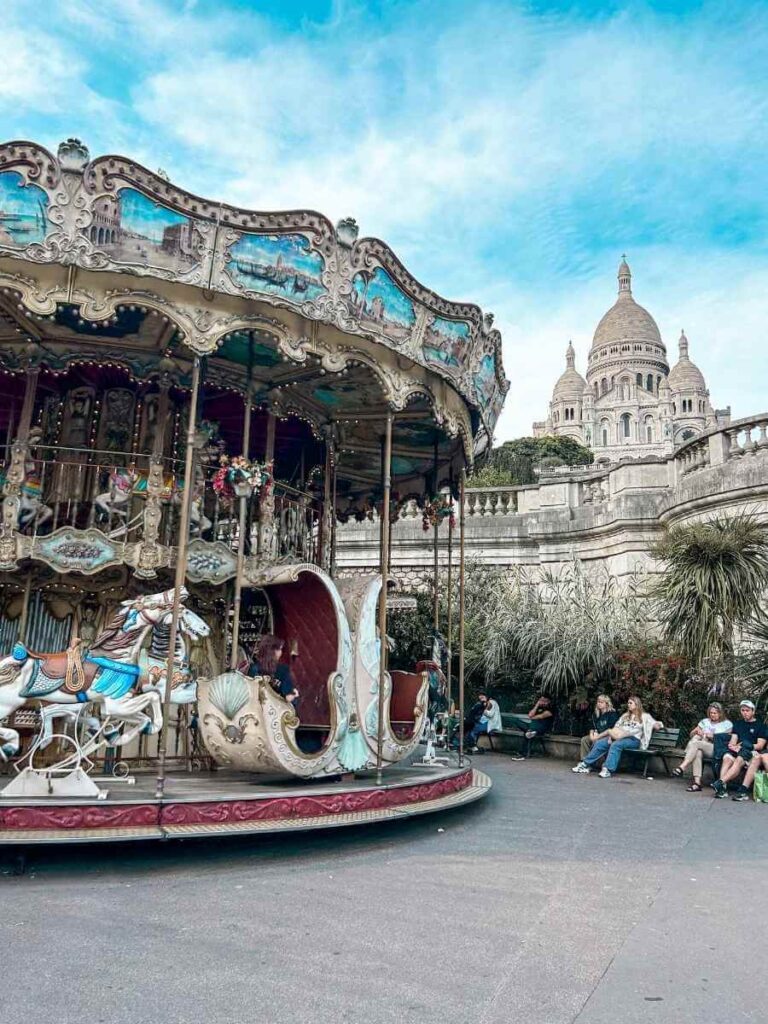 Double-decker carousel with Sacré-Cœur Basilica in the background, Montmartre