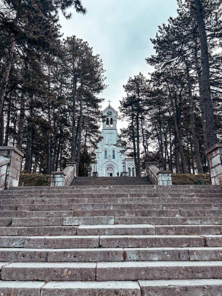 Scenic view of a church on a hilltop in Niksic Montenegro surrounded by greenery