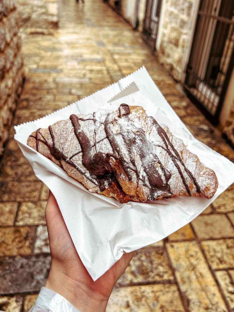 Close-up of a delicious chocolate croissant from a local bakery in Budva Old Town