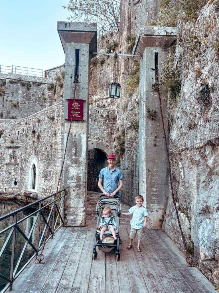 Family exploring the cobbled streets of Kotor Old Town with kids.