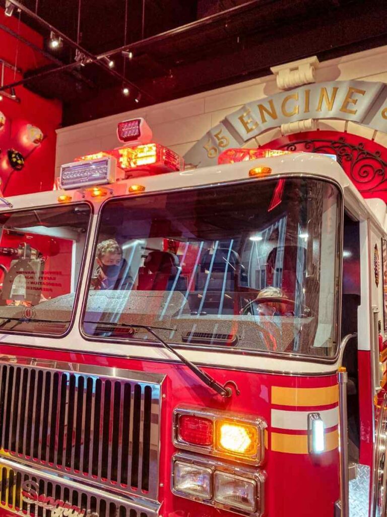 Inside the real fire engine at the FDNY NYC Store with fun firefighter-themed merchandise