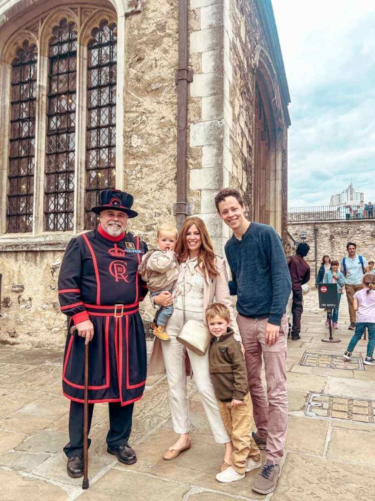 Family photo with a Yeoman Warder (Beefeater) at the Tower of London