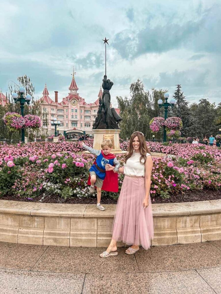 Mum and toddler entering Disneyland Paris for the first time, full of excitement and wonder.