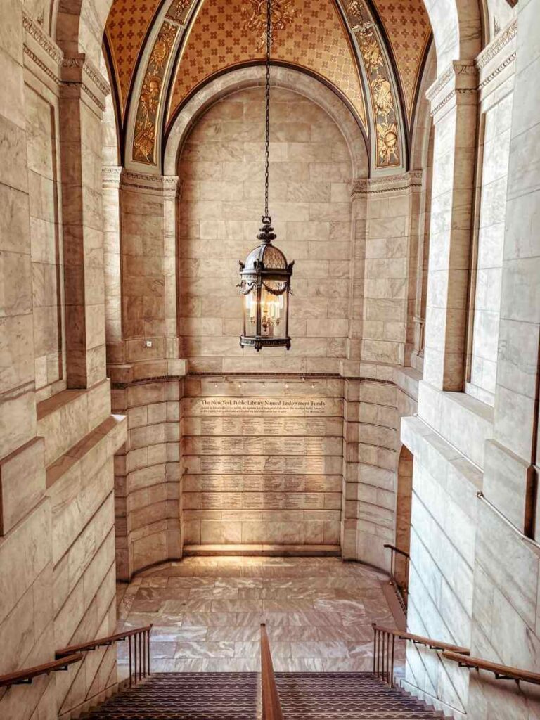 Interior of the New York Public Library with grand chandeliers and arched ceilings