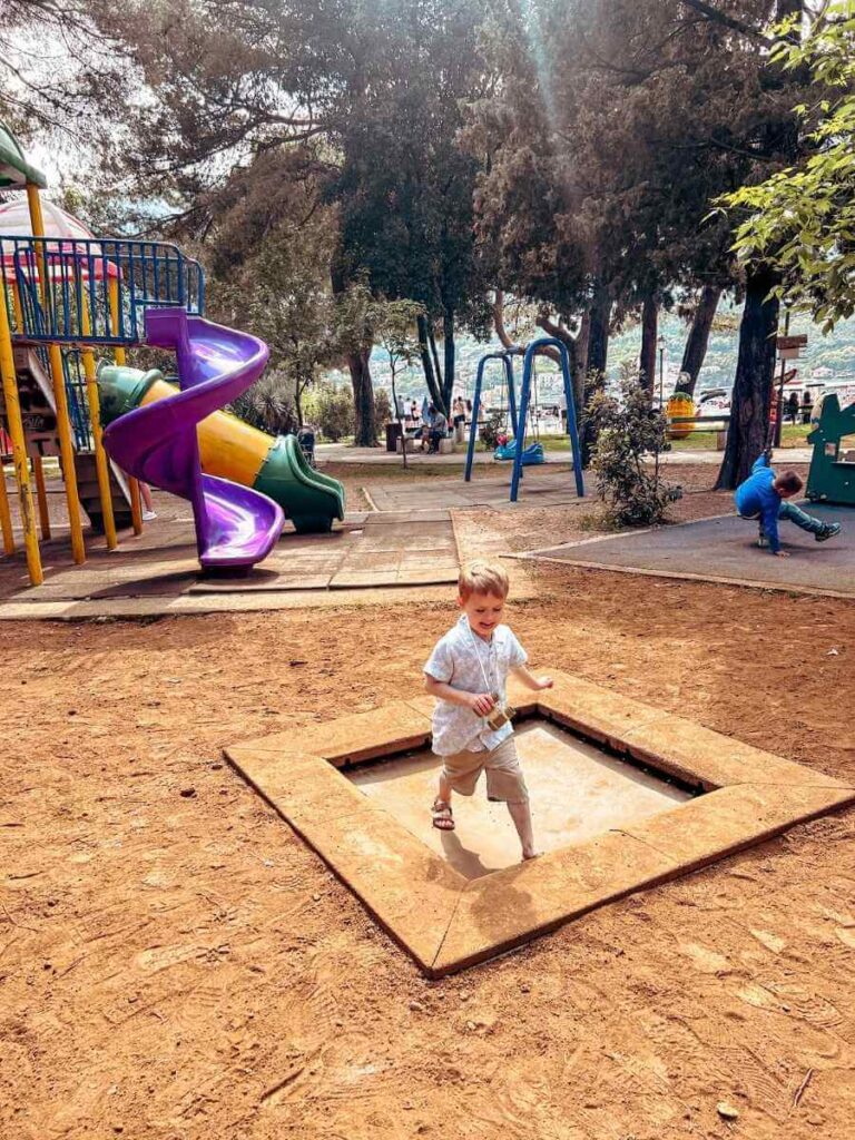 Children’s playground in Kotor with slides and climbing equipment.