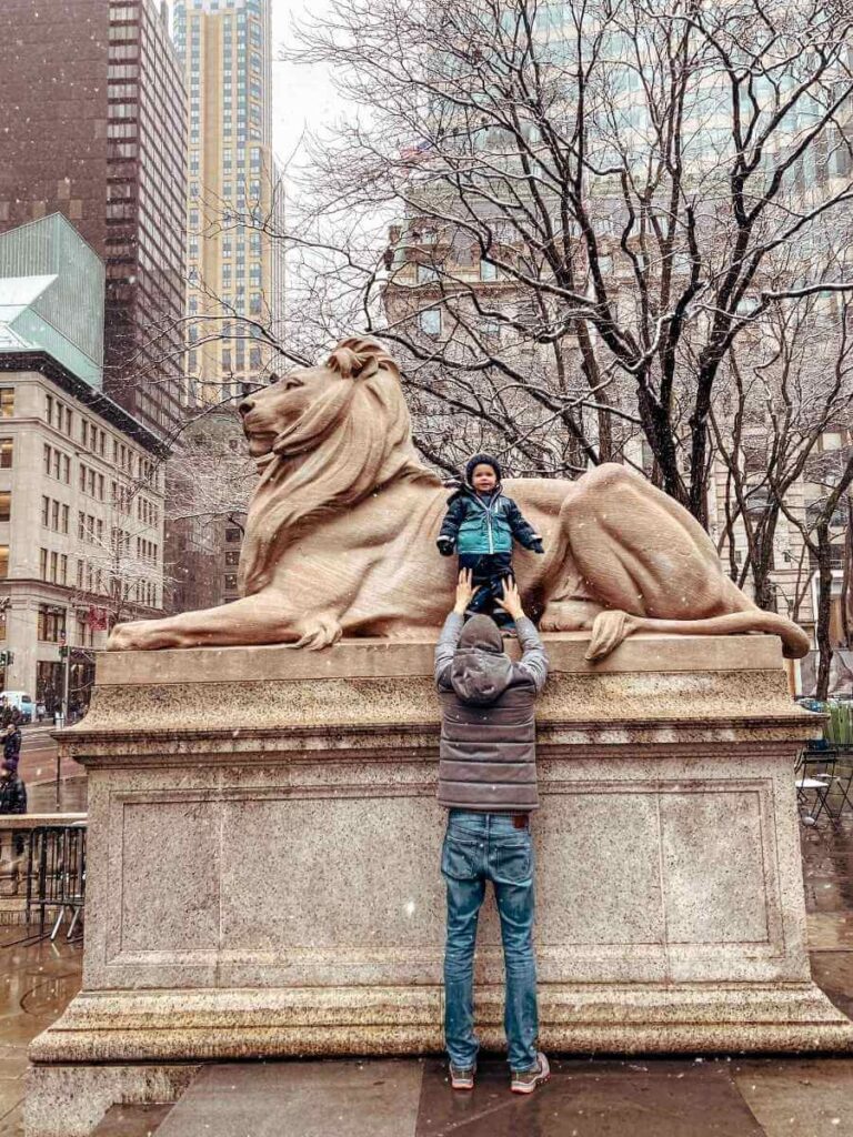 The iconic stone lion statues outside the New York Public Library entrance