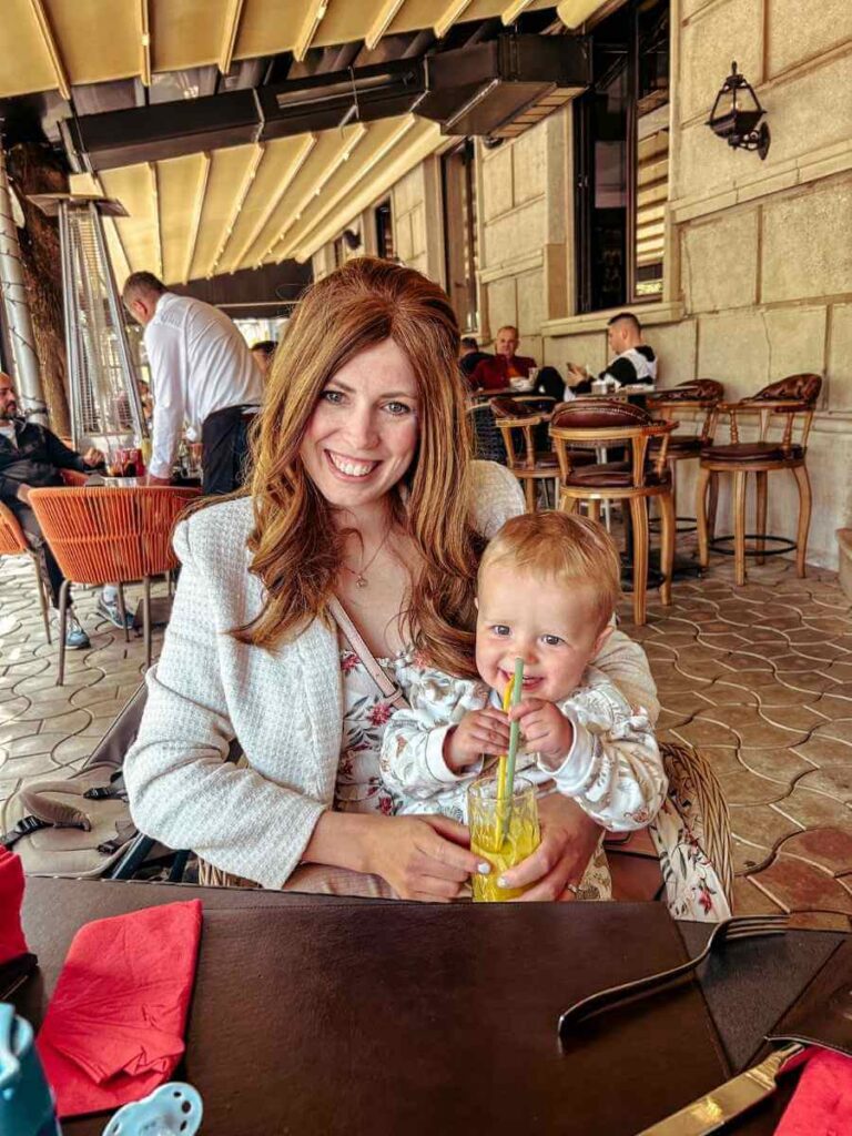 Mother and child having lunch at an outdoor cafe in Niksic Montenegro