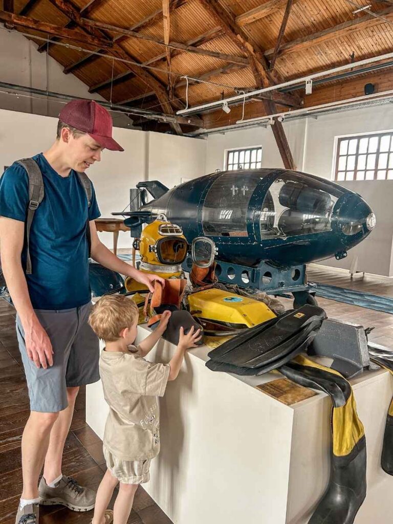 My husband and son looking at maritime artifacts inside The Maritime Heritage Museum in Tivat, Montenegro