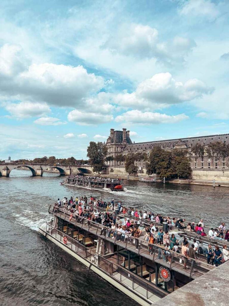 Batobus riverboat cruising along the Seine with Paris landmarks in view