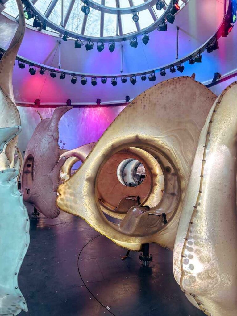 Interior of the SeaGlass Carousel with glowing lights and underwater-themed design