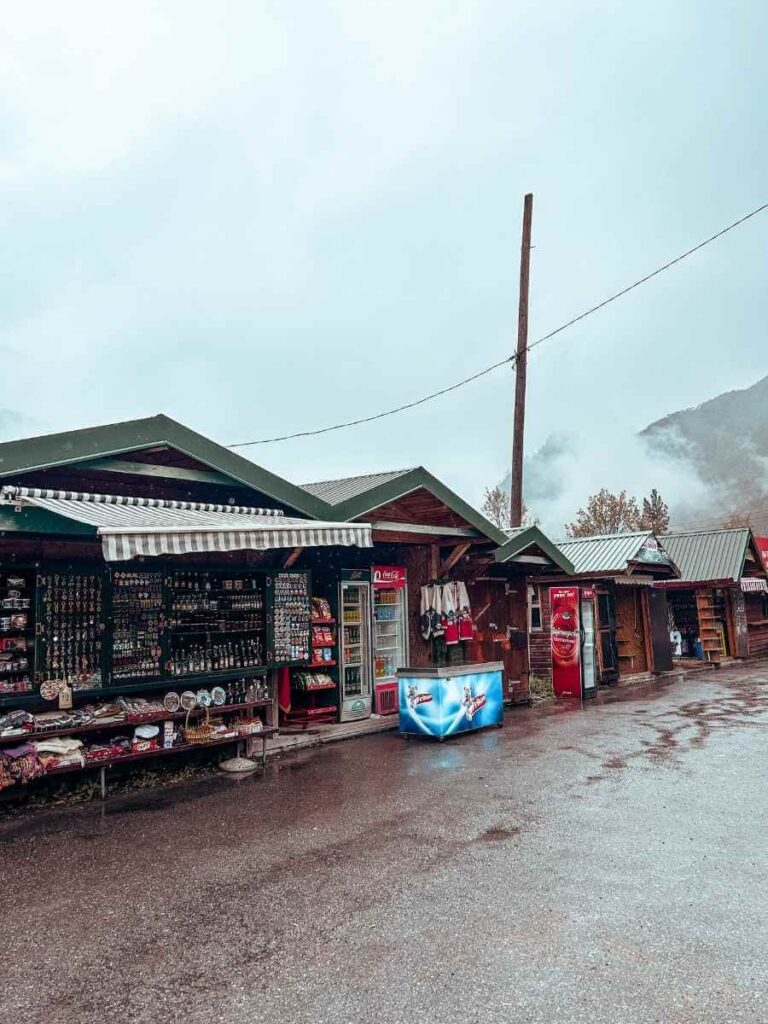 Traditional wooden souvenir huts near Tara Bridge in Montenegro, a popular spot for families