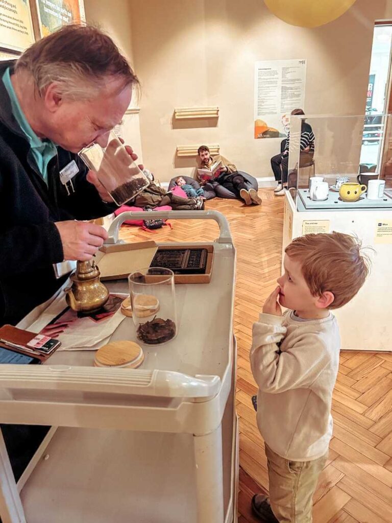 Child interacting at the hands-on desk at the Horniman Museum’s tea exhibition