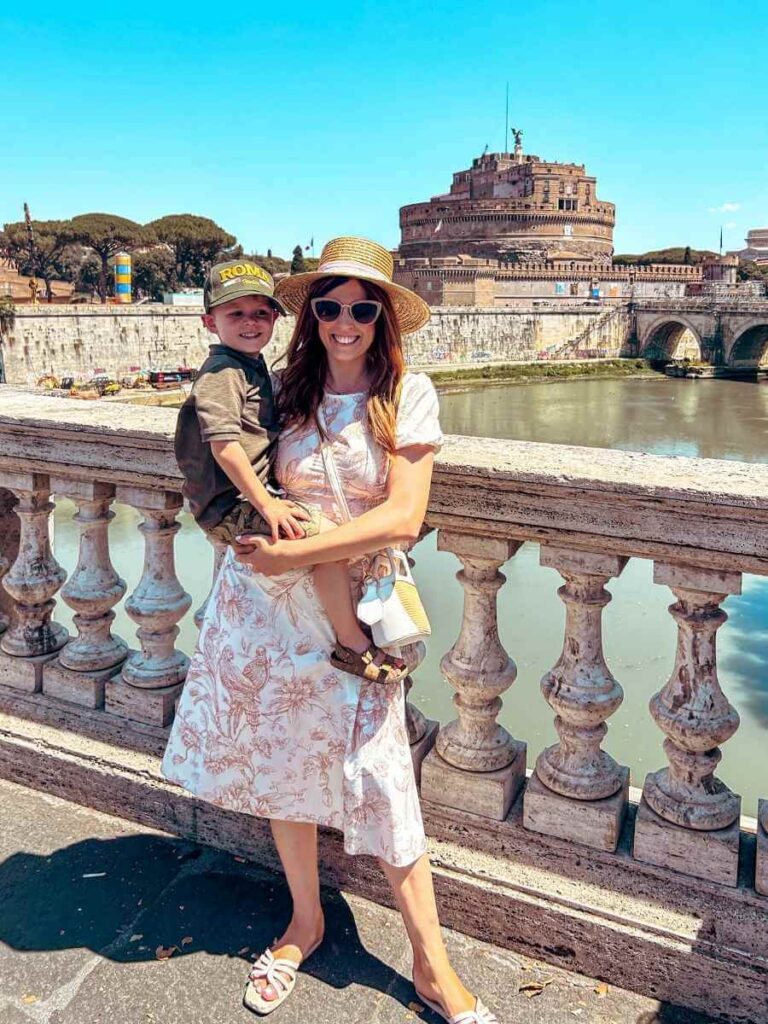 Family standing on the bridge overlooking Castel Sant’Angelo