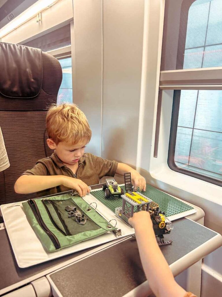 Young child doing a travel activity on the Eurostar train
