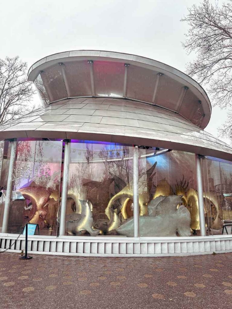 Exterior of the SeaGlass Carousel in Battery Park with whimsical fish-shaped ride vehicles