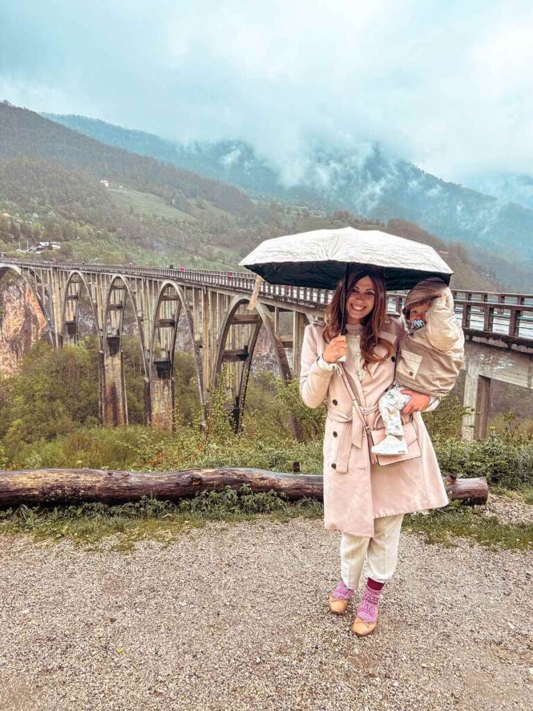 Mother and baby at Tara Canyon with Đurđevića Tara Bridge in the background, Montenegro family trip