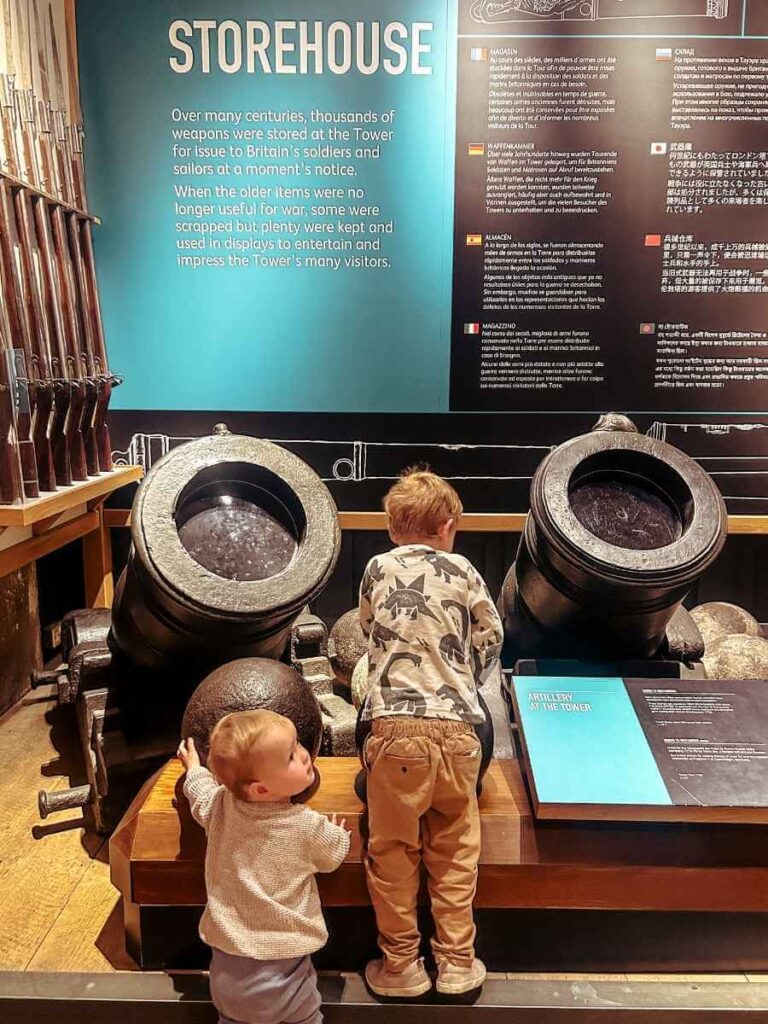 Children engaging with a hands-on exhibit during a visit to the Tower of London