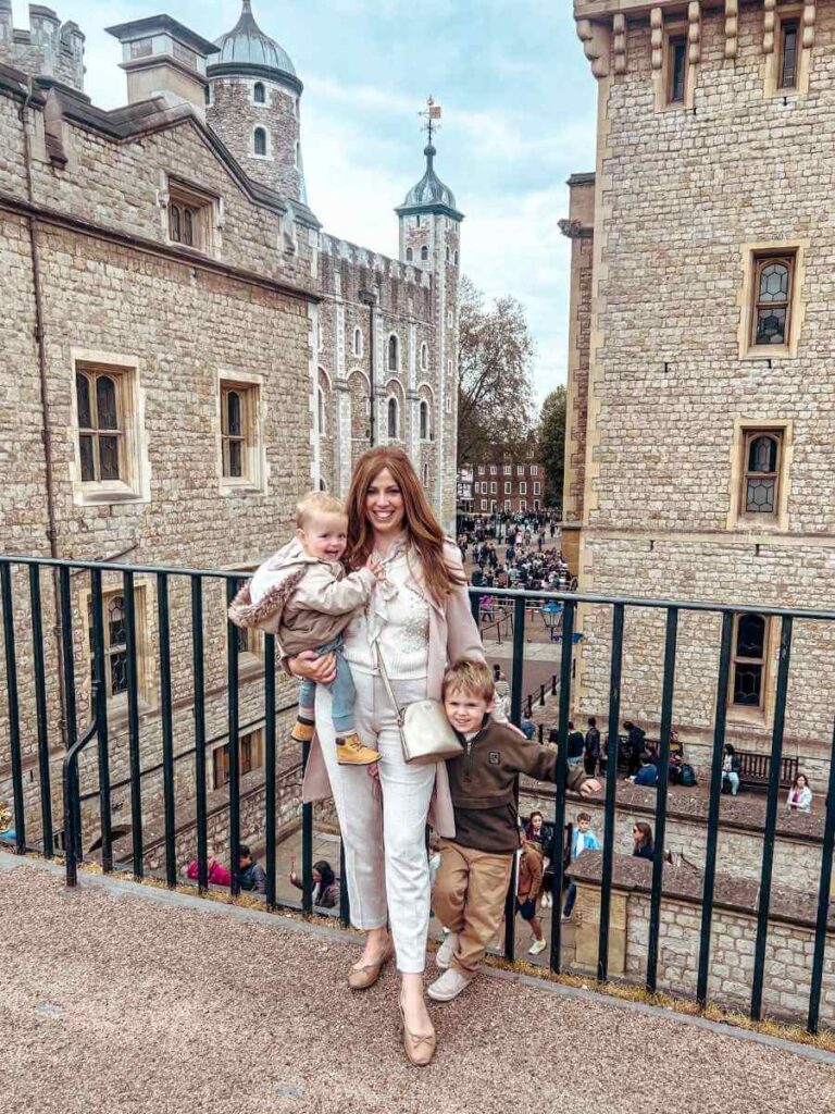 Family exploring the Tower of London ramparts with views of the inner ward