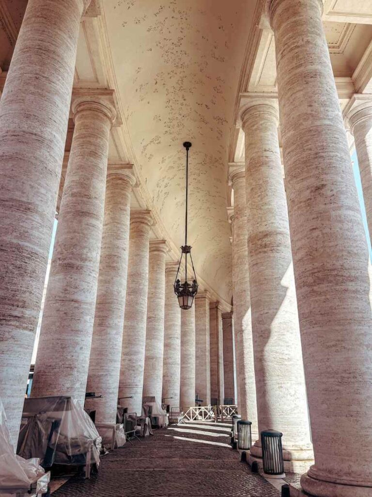 Elegant marble columns at St. Peter’s Square in Vatican City, a stunning architectural spot perfect for Instagram photos.