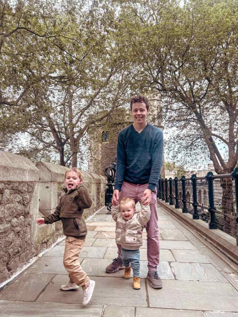 Walking along the historic battlements of the Tower of London with kids