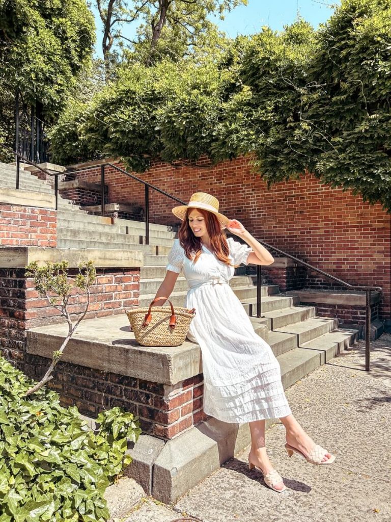 Sitting on the steps in the Conservatory Garden, Central Park, a hidden New York Instagram spot.
