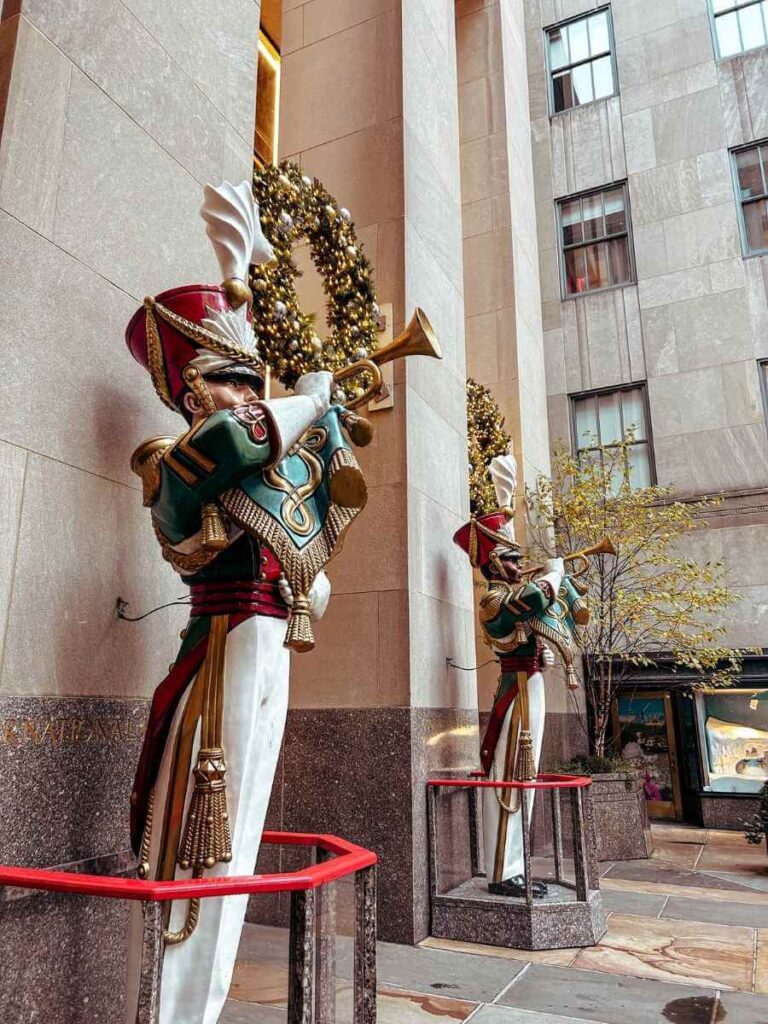 Festive Christmas decorations along Fifth Avenue in New York, perfect for a holiday walk with kids.