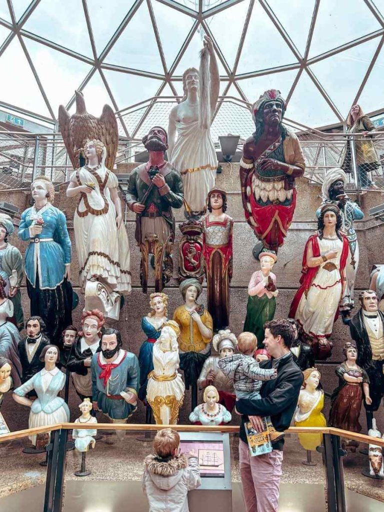 Display of historic ship figureheads at the Cutty Sark, Greenwich.