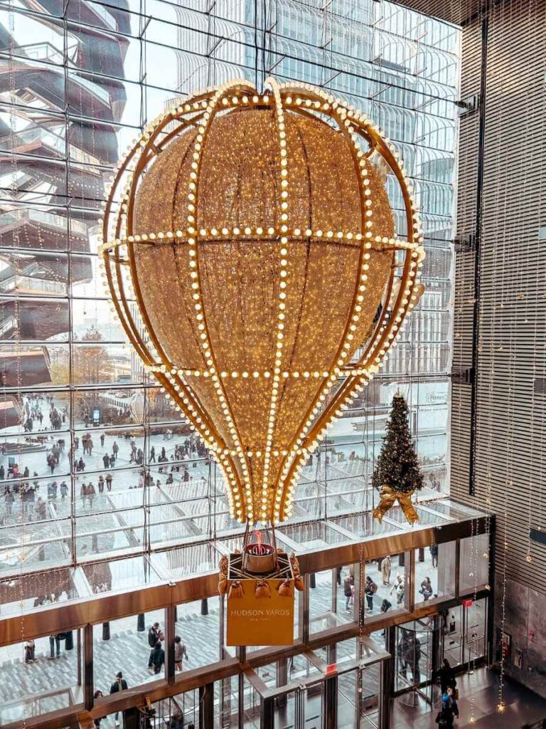 Giant air balloon decorations at Hudson Yards during NYC Christmas time, a fun stop for families.