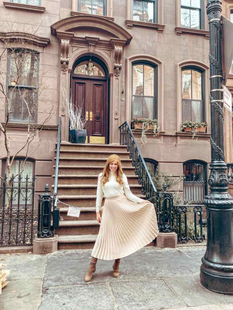 Neutral outfit with a beige midi skirt and cream roll neck jumper — classic feminine style for a timeless, minimal wardrobe.