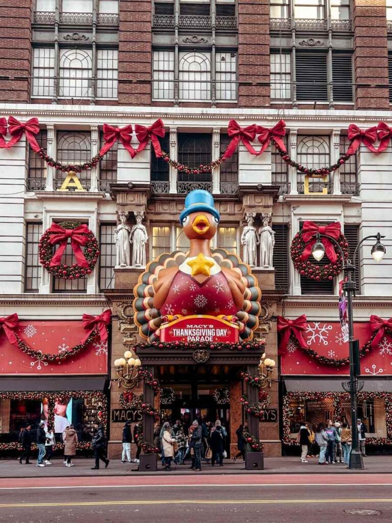The outside view of Macy's in NYC decorated with beautiful holiday decorations.