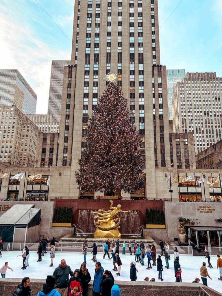 Skating at the Rockefeller Rink under the Christmas tree — an iconic New York Christmas activity.