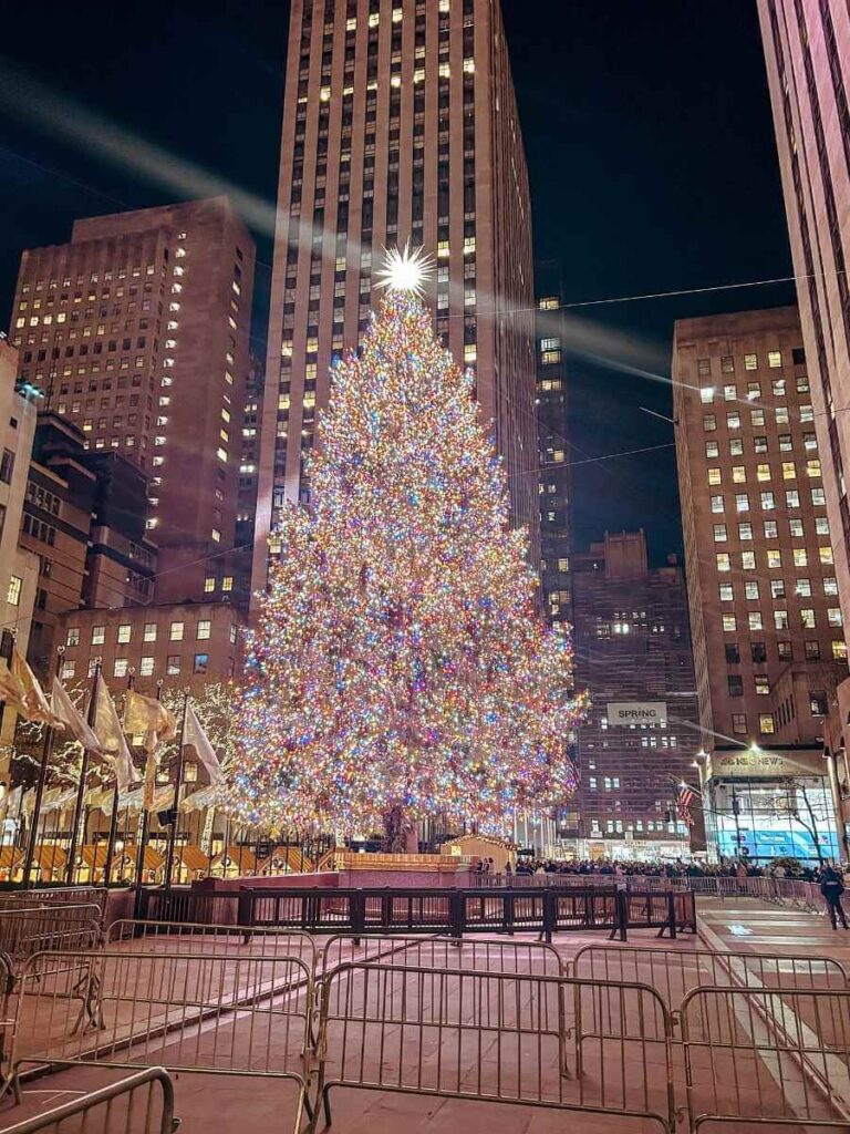 The Rockefeller Center Christmas tree lit up at night — a classic New York Christmas experience with kids.