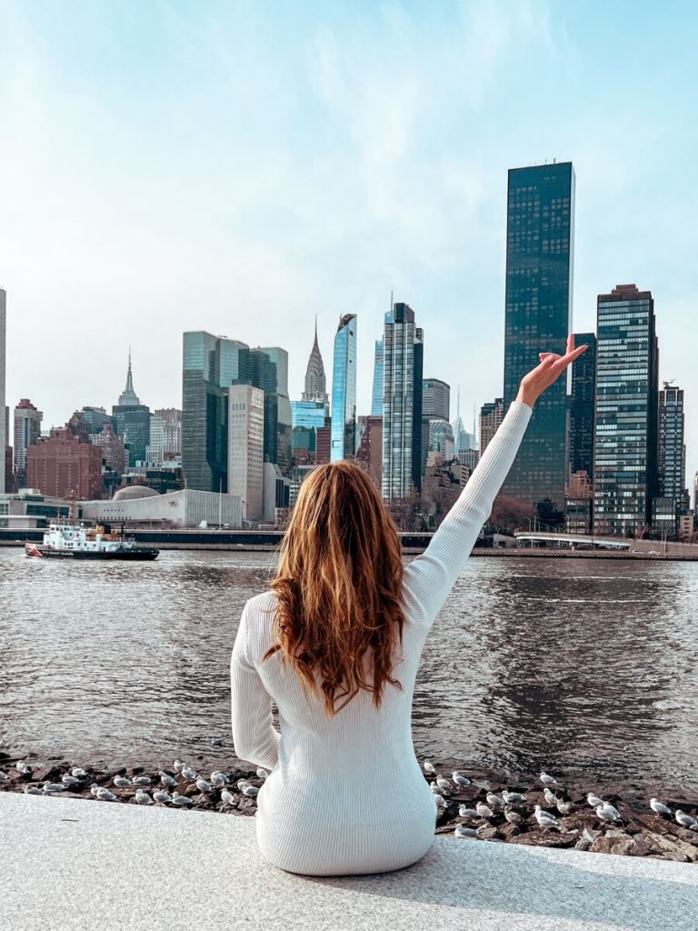 On Roosevelt Island with the Manhattan skyline in the background, a unique NYC photo location.

