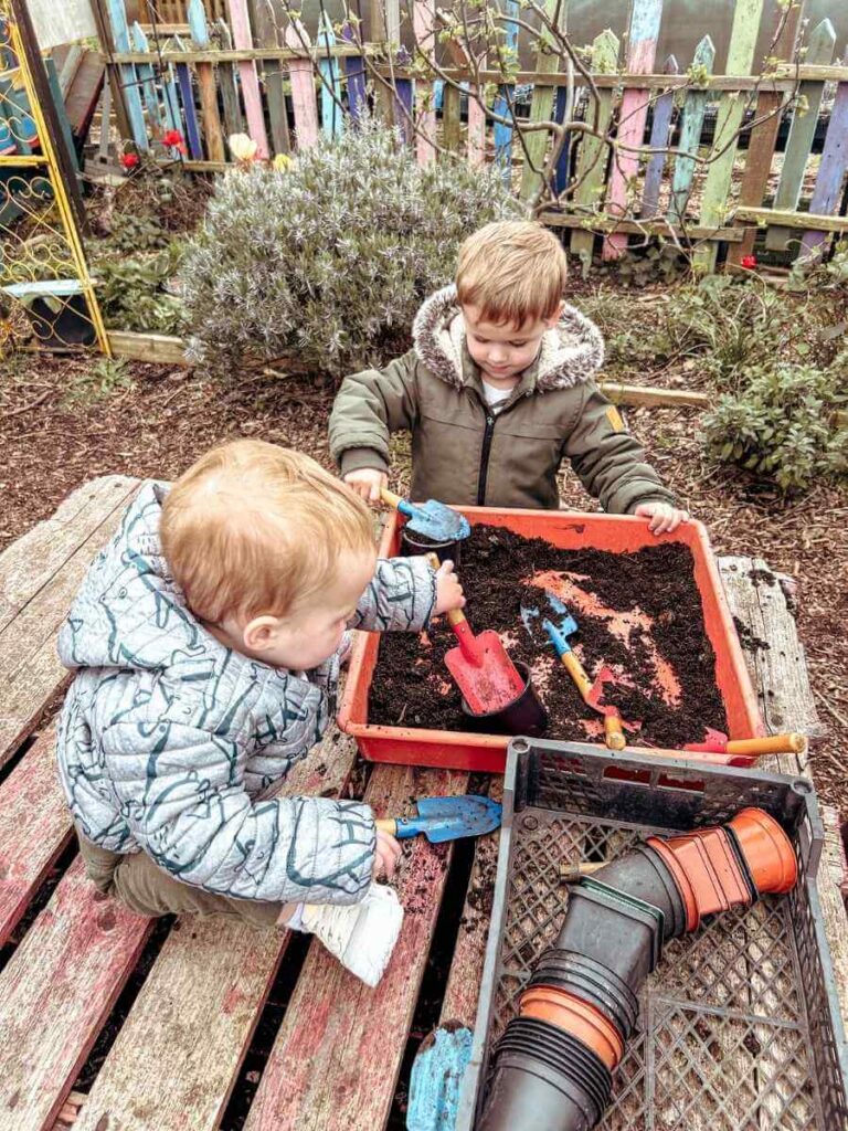 Children participating in a gardening activity at Stepney City Farm, one of the best city farms for kids in London.