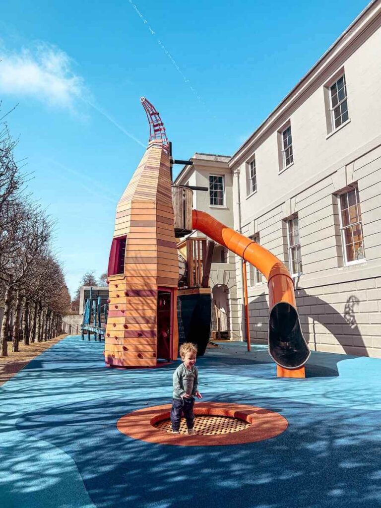 Outdoor pirate ship climbing frame and slide at the Cove Playground, part of the family-friendly National Maritime Museum in Greenwich.