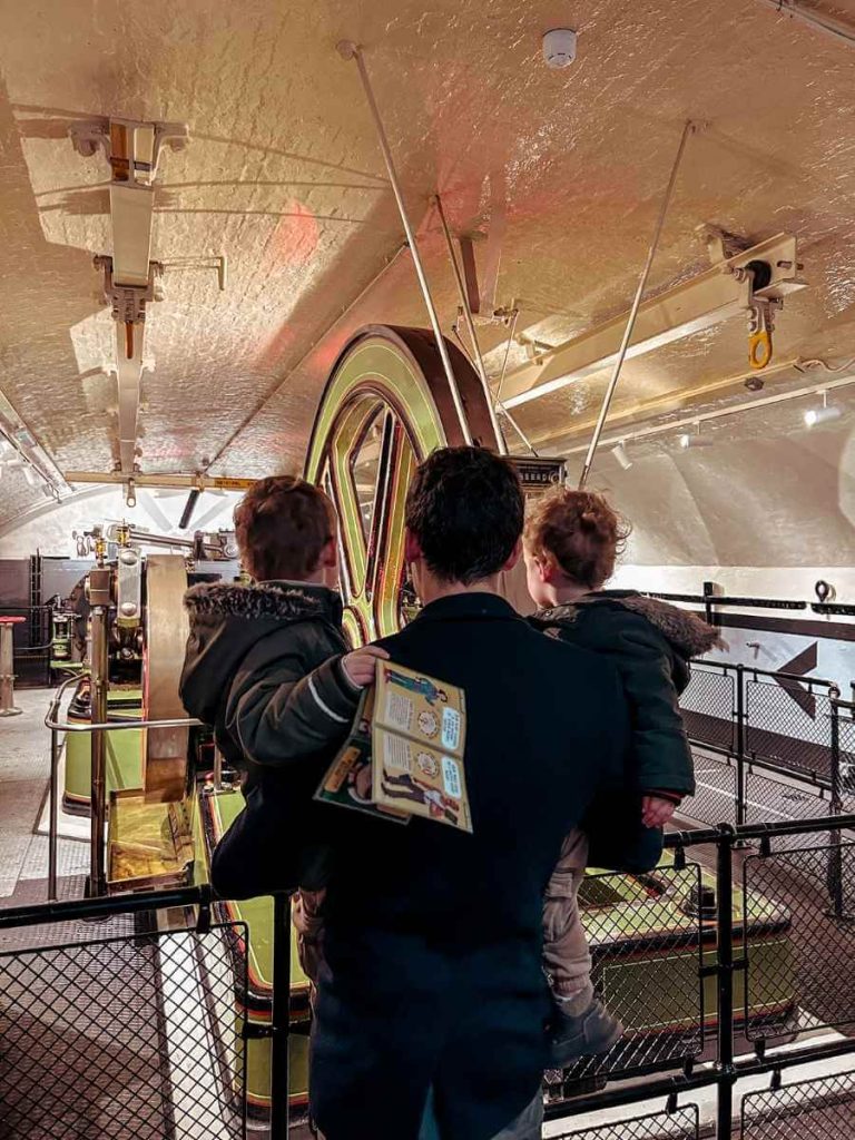 Looking at the engine room at Tower Bridge with kids
