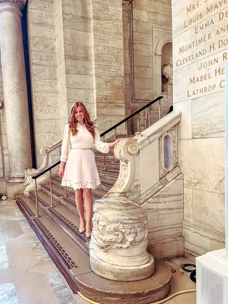 on the beautiful steps inside the New York Public Library